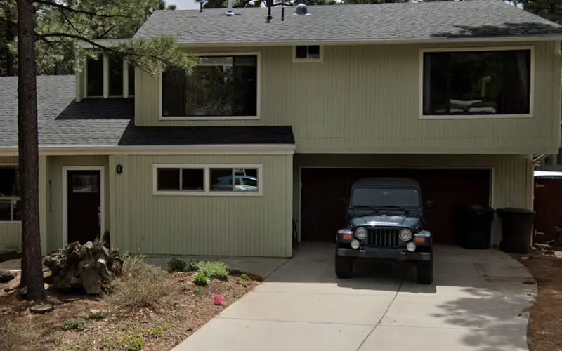 Jeep Parked Outside of Garage
